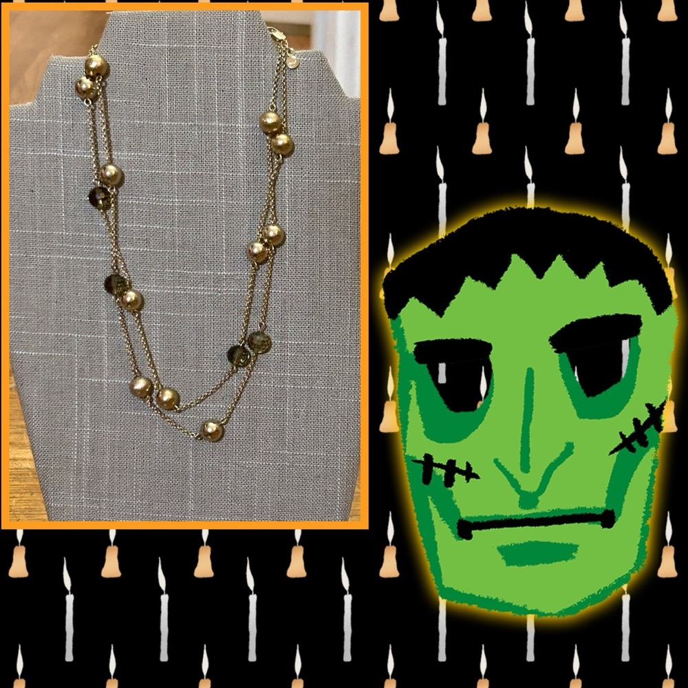 Gold and clear black beaded gold tone necklace
